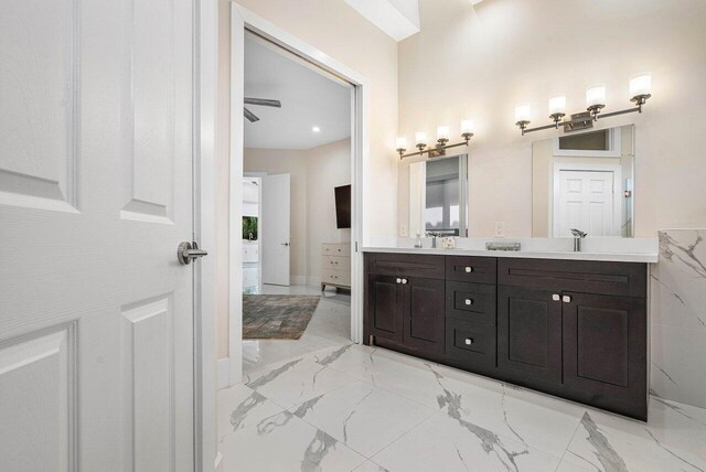 bathroom with ceiling fan and vanity