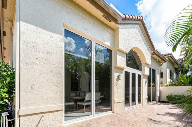 entrance to property with a patio