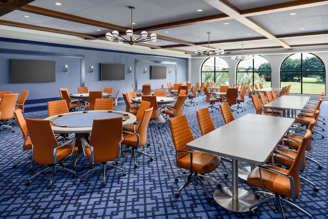 dining room with plenty of natural light, coffered ceiling, dark colored carpet, and a chandelier