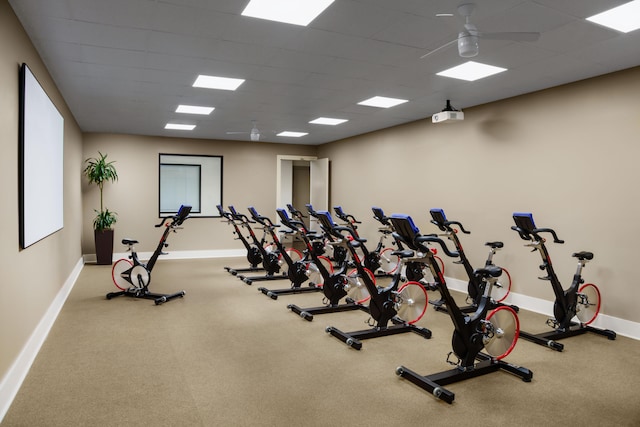 exercise room with ceiling fan