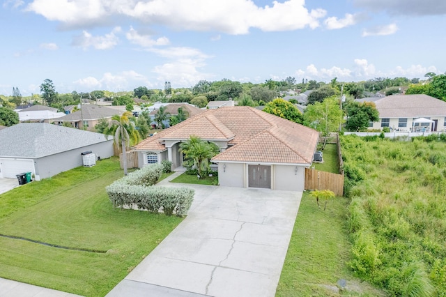 view of front of house with a front lawn and a garage