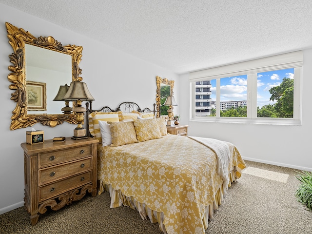 carpeted bedroom with a textured ceiling