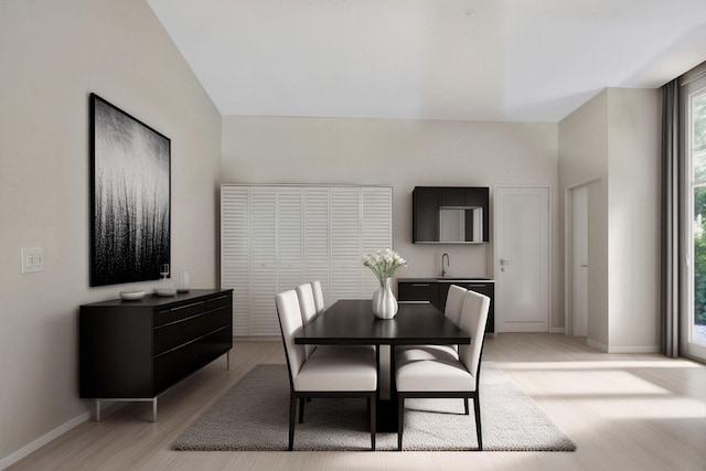 dining room featuring light hardwood / wood-style flooring and sink