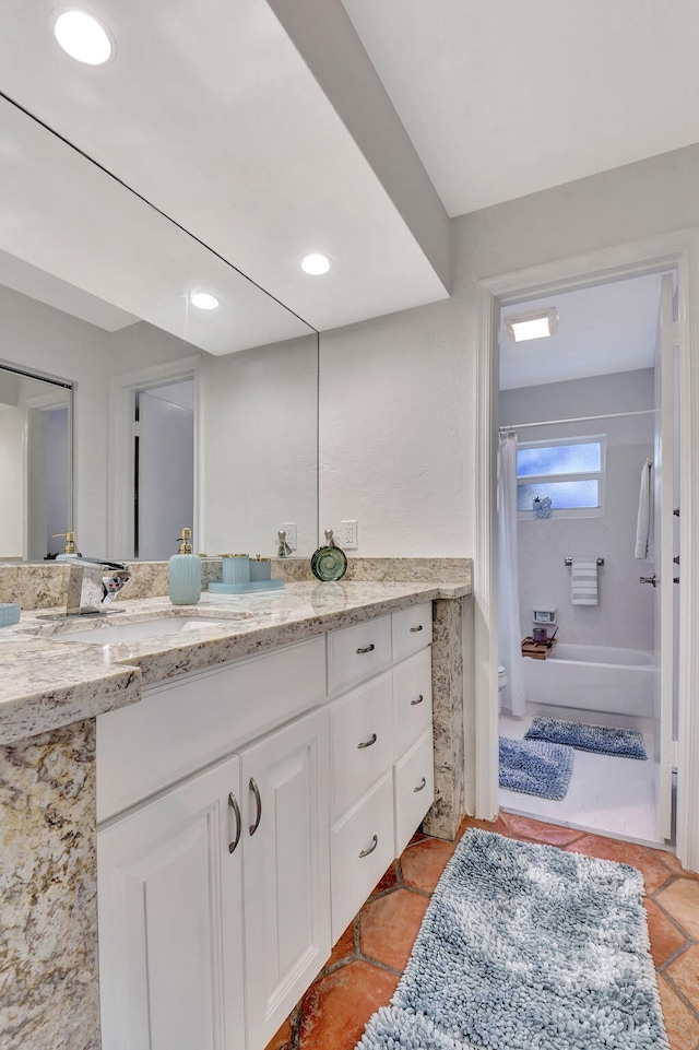 bathroom with shower / bath combo with shower curtain and vanity