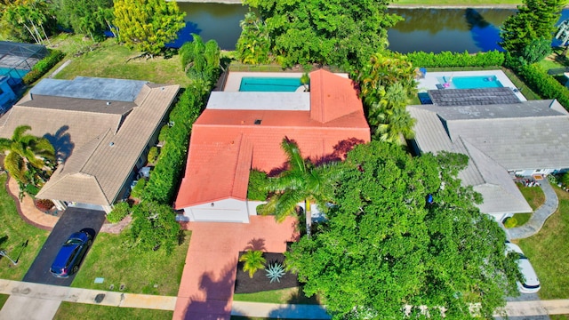 birds eye view of property with a water view