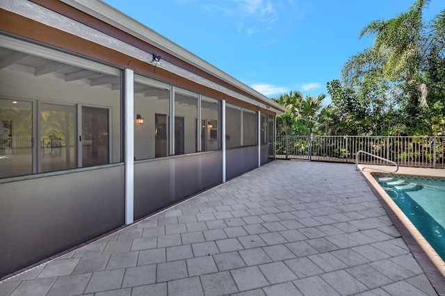 view of patio featuring a fenced in pool