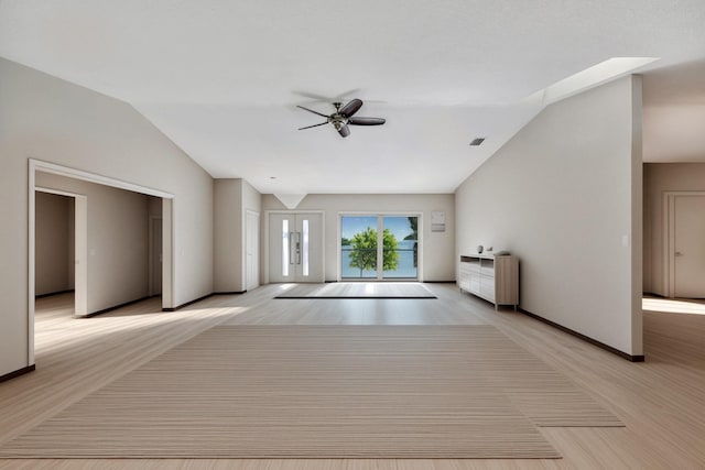 unfurnished living room with ceiling fan with notable chandelier, lofted ceiling, and french doors