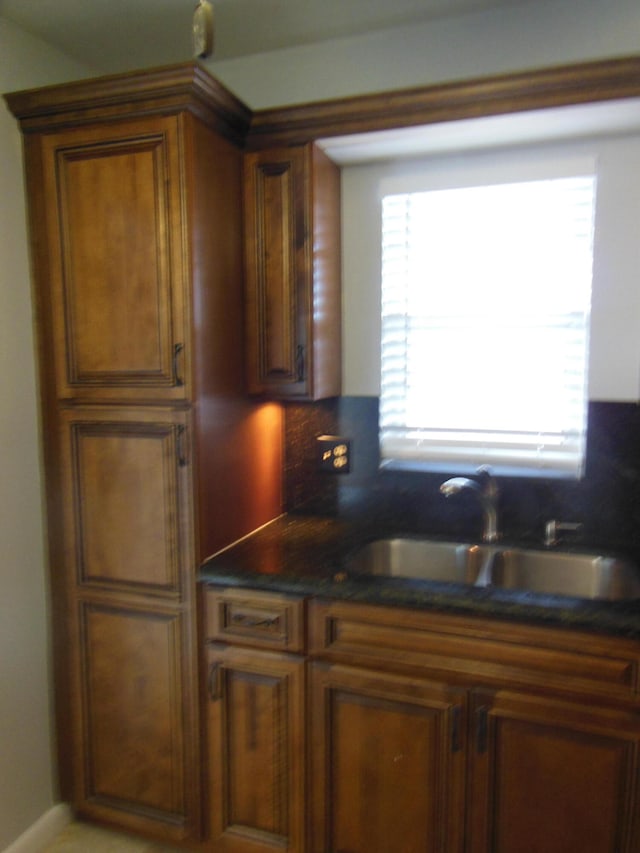 kitchen with decorative backsplash and sink