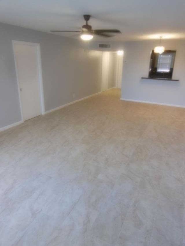 spare room featuring ceiling fan