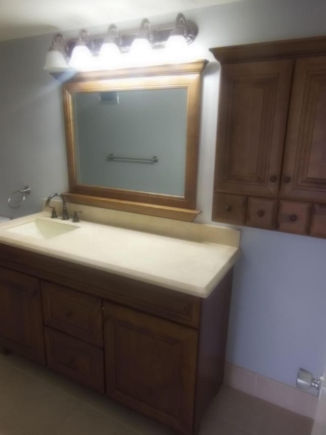 bathroom with tile patterned flooring and vanity