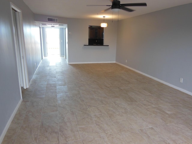 405 US Highway 1 Unit 307, Palm Beach Gardens, FL 33408 - unfurnished living room with ceiling fan and baseboards