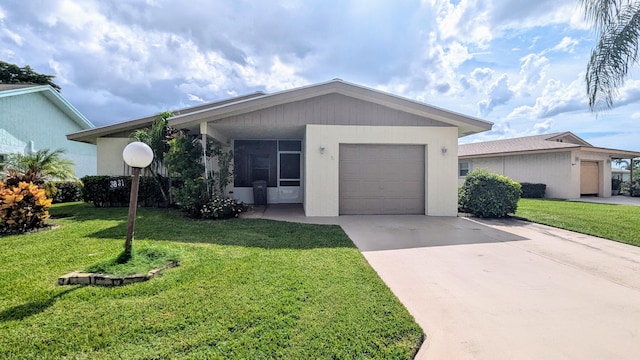 ranch-style home with a front yard and a garage