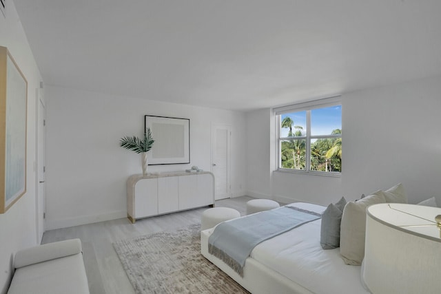 bedroom with light hardwood / wood-style floors