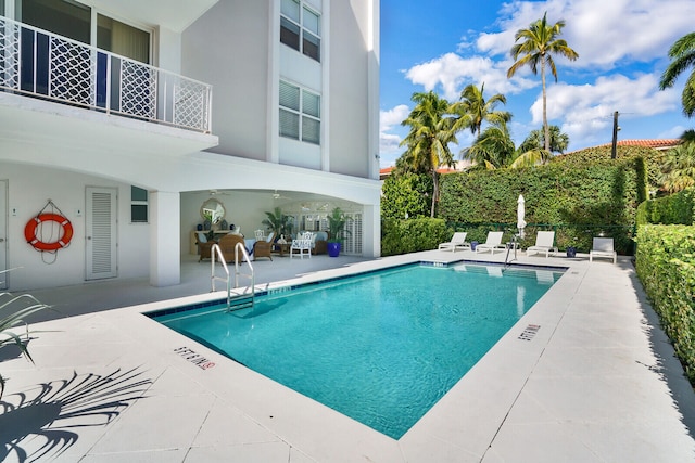 view of swimming pool featuring a patio