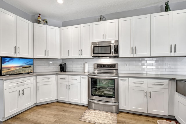 kitchen featuring white cabinets and stainless steel appliances