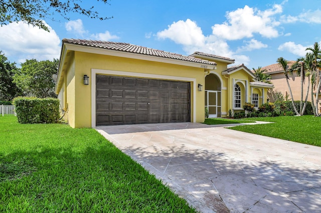 mediterranean / spanish-style house with a front lawn and a garage