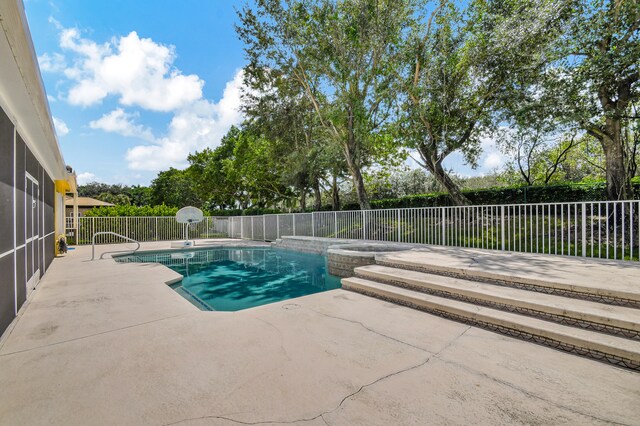 view of pool featuring a patio