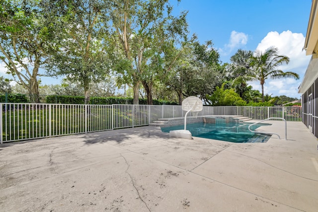 view of pool featuring a patio