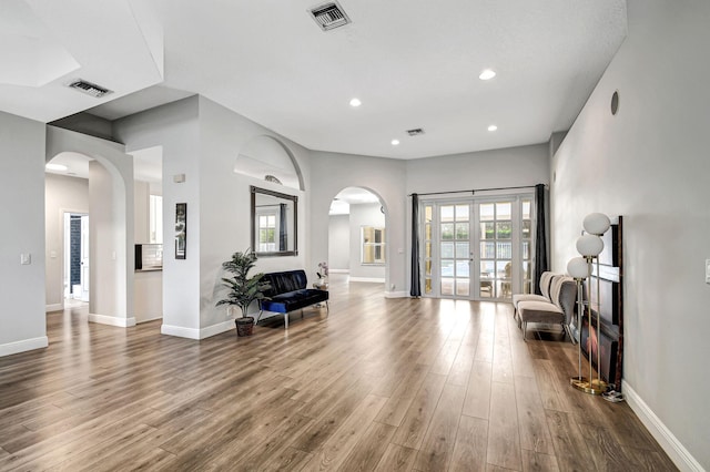 interior space with hardwood / wood-style floors and french doors