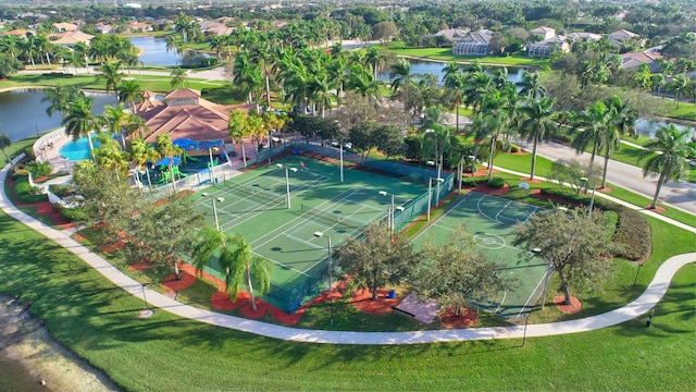 birds eye view of property with a water view