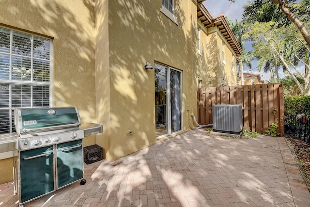 view of patio with grilling area and central AC