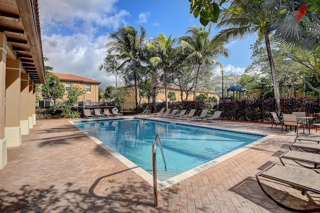 view of swimming pool featuring a patio area