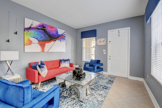 living room featuring plenty of natural light and light tile patterned flooring