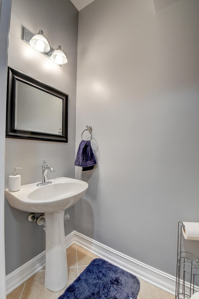 bathroom featuring tile patterned flooring and sink