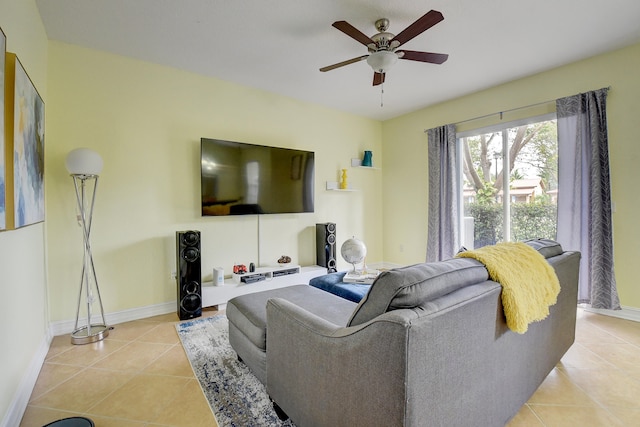 living room featuring ceiling fan and light tile patterned floors