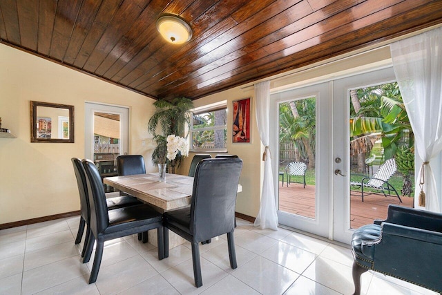dining area featuring vaulted ceiling, light tile patterned flooring, french doors, and wooden ceiling