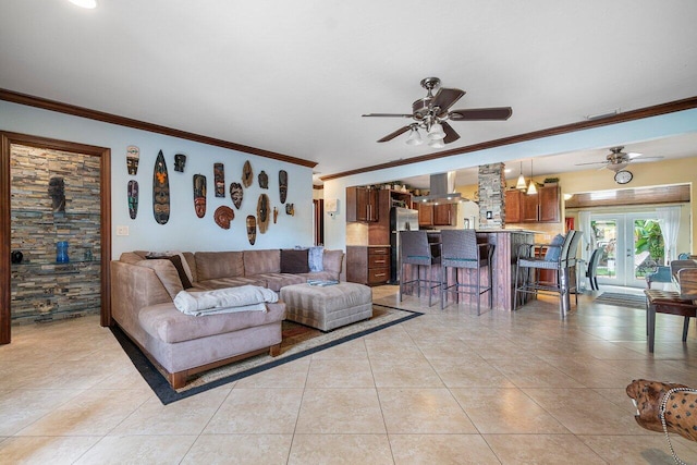 living room with ceiling fan, ornamental molding, light tile patterned flooring, and french doors