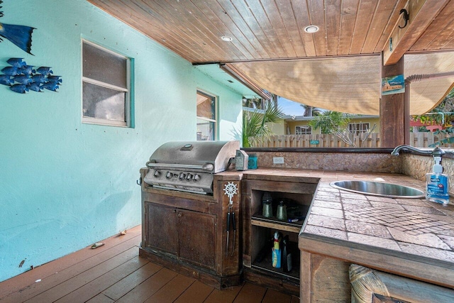view of patio / terrace featuring a sink, grilling area, area for grilling, and fence