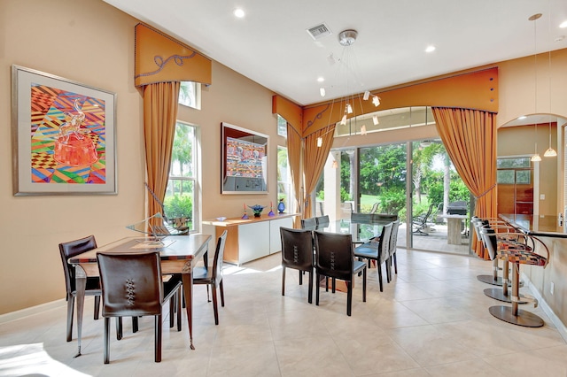 tiled dining area featuring a wealth of natural light