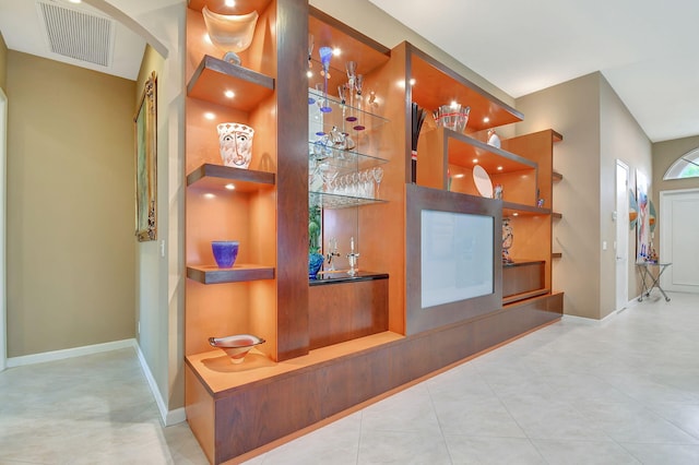 interior details with tile patterned flooring and bar area