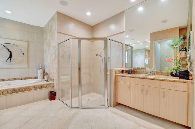 bathroom featuring vanity, separate shower and tub, and tile patterned floors