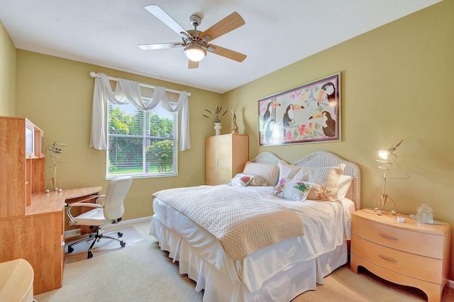 bedroom featuring ceiling fan and light colored carpet