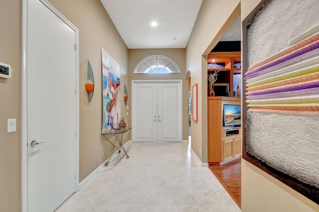 foyer with tile patterned floors