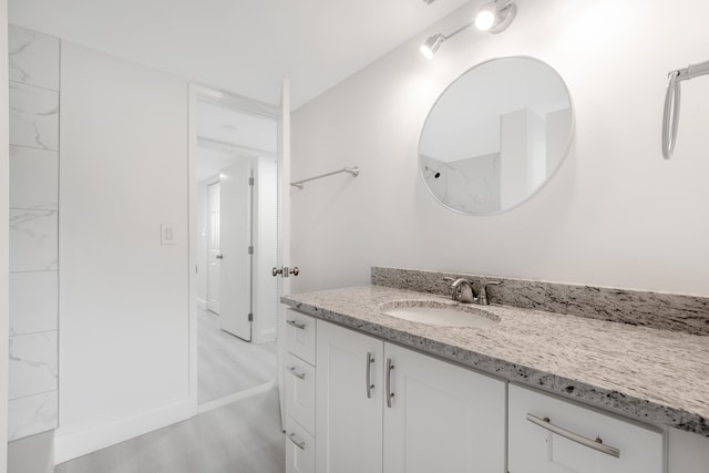 bathroom featuring vanity and hardwood / wood-style floors