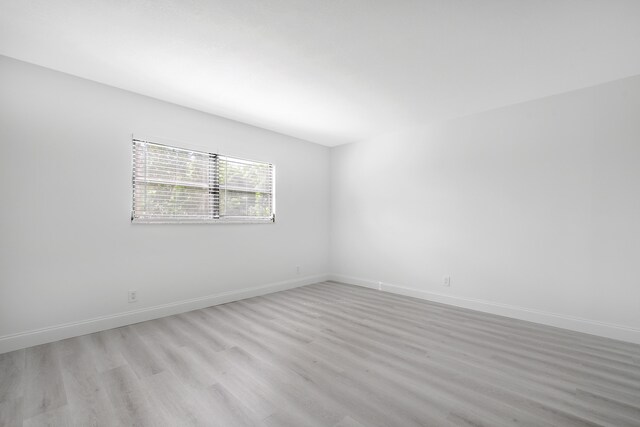 spare room featuring light hardwood / wood-style flooring