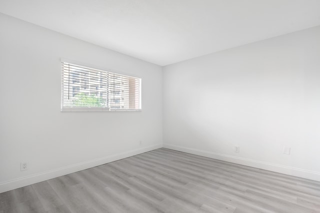 spare room featuring light wood-type flooring