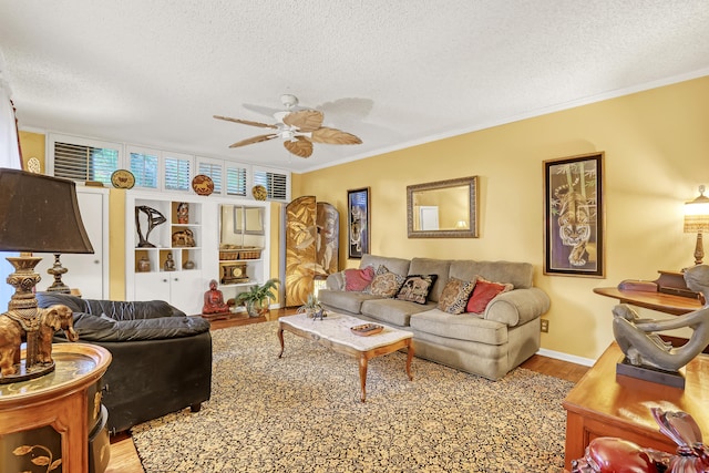 living room with light wood-type flooring, a textured ceiling, and ceiling fan