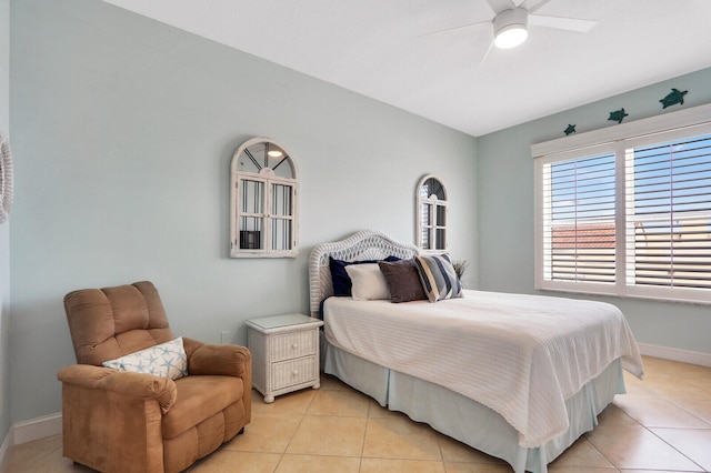 tiled bedroom with ceiling fan