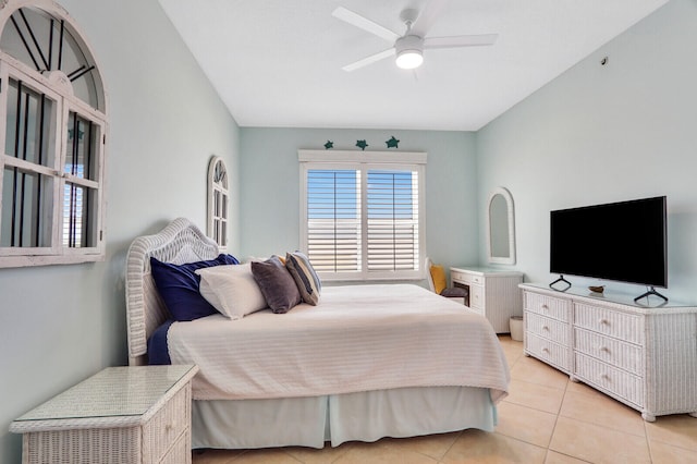 tiled bedroom with ceiling fan