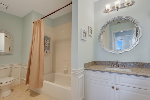 full bathroom featuring shower / bath combo, tile patterned flooring, vanity, and toilet