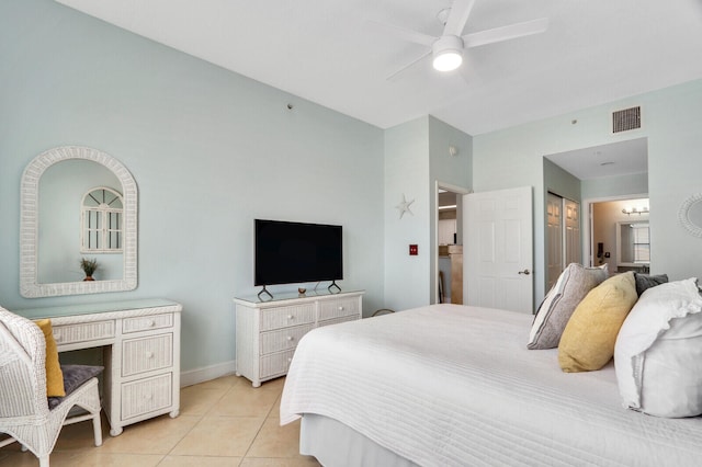 tiled bedroom featuring ceiling fan