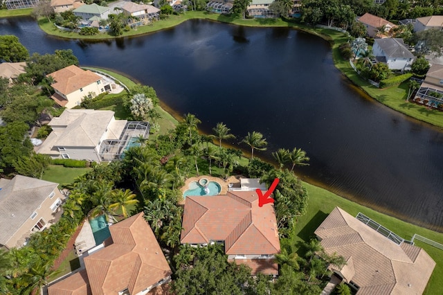 bird's eye view featuring a water view and a residential view