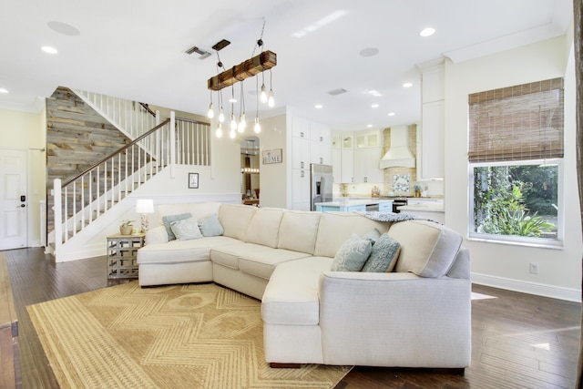 living room featuring hardwood / wood-style floors and ornamental molding