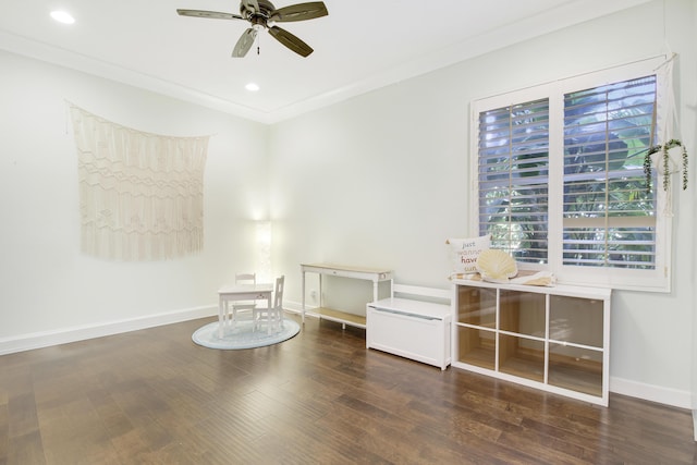 unfurnished room featuring ceiling fan, crown molding, and dark hardwood / wood-style flooring