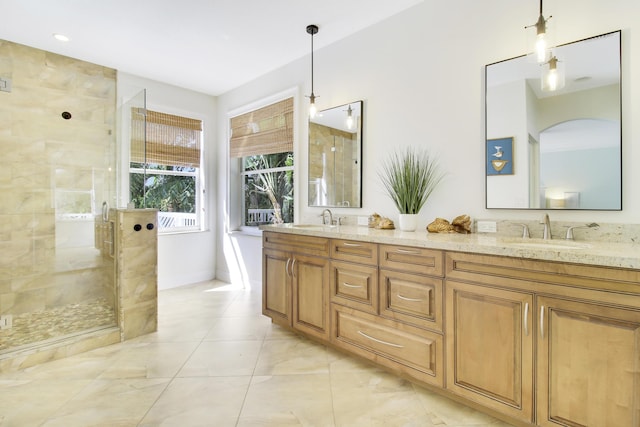 bathroom featuring vanity and a shower with shower door