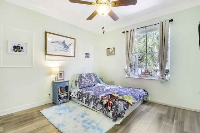 bedroom featuring ceiling fan and wood-type flooring